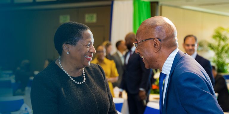 A woman and a man smiling in a room. Sustainable Development - Inter-American Development Bank - IDB