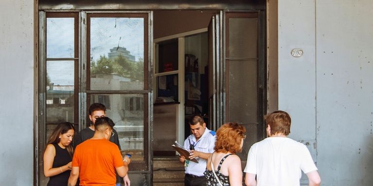 a group of people standing outside a building