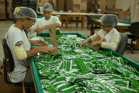 People working in a factory - Financing - Inter American Development Bank - IDB